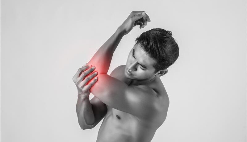 portrait-muscle-man-having-elbow-pain-isolated-white-background